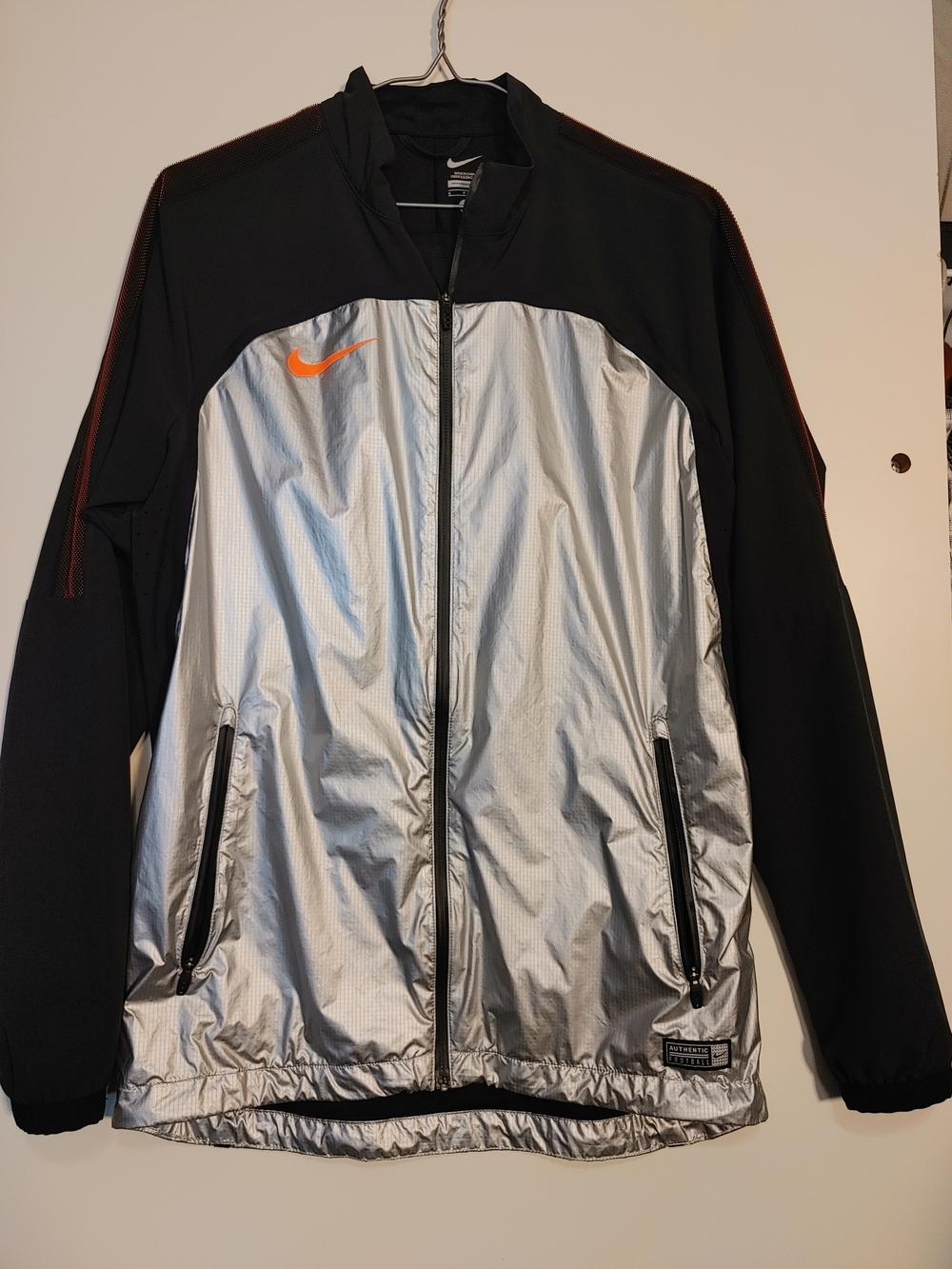 Nike Men’s Silver Front Black Sleeve Performance Jacket with Orange Swoosh